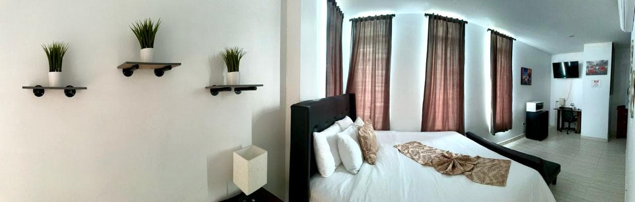 king bed with futon and amenities