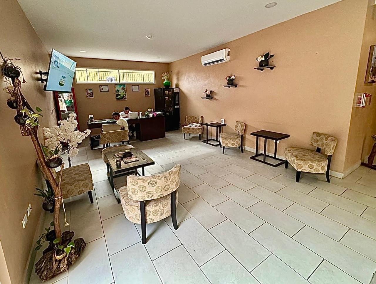 Lobby area with people at the front desk.